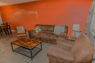 a living room with a couch and a table at Reno Retreat 3 King Beds by Casinos and University in Reno