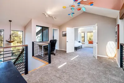 a home office with a desk and a room at Spacious Mountain View Oasis - Pool, Spa & Game Rm in Oakhurst