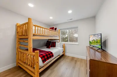 a bedroom with a bunk bed and a ladder at Cozy Condo for 8 Hot-Tub HOA Amenities Walk to Beach Close to Slopes in Tahoe City