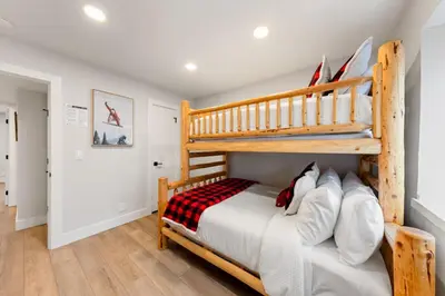 a bedroom with a bunk bed and a ladder at Cozy Condo for 8 Hot-Tub HOA Amenities Walk to Beach Close to Slopes in Tahoe City