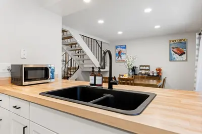 a kitchen with a sink and a microwave at Cozy Condo for 8 Hot-Tub HOA Amenities Walk to Beach Close to Slopes in Tahoe City