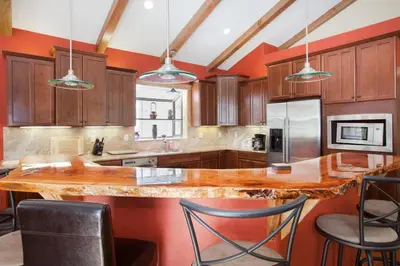 a large kitchen with a large wooden counter top at Luxury Home Near Lake, Heavenly, Casinos in South Lake Tahoe