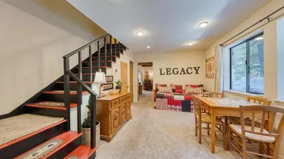 a living room with a staircase and a dining room at Mountain Cabin w Fireplace Balcony Easy Ski Access Bear Americana in Truckee
