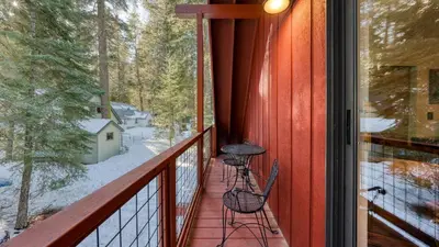 a balcony with two chairs and a grill on it at Mountain Cabin w Fireplace Balcony Easy Ski Access Bear Americana in Truckee