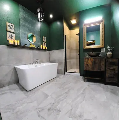 a bathroom with a white tub and green walls at Asian Zen Den in Sparks