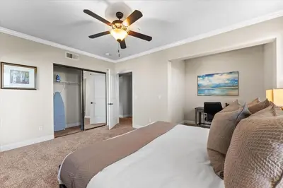 a bedroom with a bed and a ceiling fan at New Luxurious 1BR Apartment Heated Pool Spa & Sauna in Reno