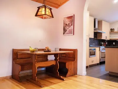 a kitchen with a wooden table with bananas on it at Mountain Retreat near Skiing, HotTub, PetFriendly in Tahoe City