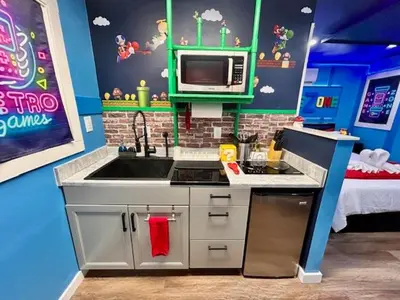 a toy kitchen with a sink and a microwave at GameZone in Sparks
