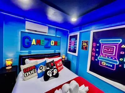 a room with a bed with a video game room at GameZone in Sparks