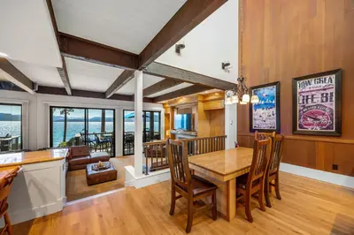 a kitchen and dining room with a table and chairs at Remodeled 4BR Lakefront with Exceptional Amenities in Kings Beach