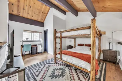 a bedroom with a bunk bed and a desk at Alpine Retreat in the Heart of Incline Village condo in Incline Village