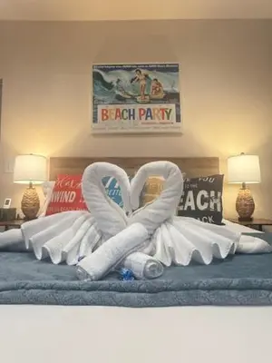 a bed with a heart made out of pillows at Beach House Staycation in Sparks