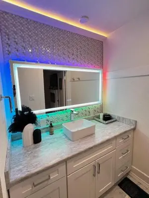a bathroom with a sink and a mirror at MidTown Art Deco in Reno