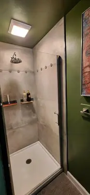 a shower with a glass door in a bathroom at MidTown Zen Den in Reno