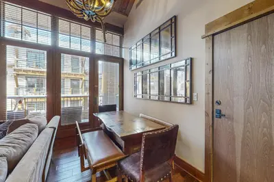 a living room with a table and a couch at Northstar Escape + Northstar Getaway in Truckee