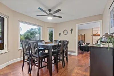 a dining room with a table and chairs at Huge House-Yard-Pool Hot Tub in Citrus Heights