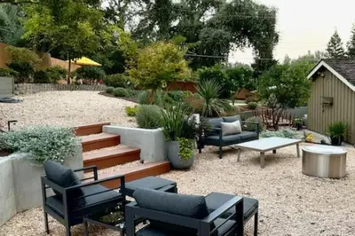 a patio with couches and a table and chairs at King Bed-Peaceful Modern Cottage-Garden Setting in Carmichael