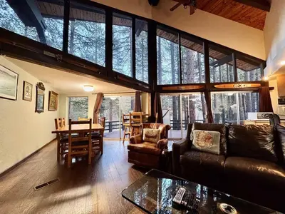 a living room with a couch and a table at One The First Fairway - Walk to the Lake in Incline Village