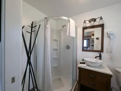 a bathroom with a shower and a sink at Squaw Valley Motel Room 8 in Squaw Valley