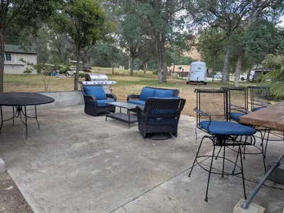 a group of chairs and tables in a park at Squaw Valley Motel Room 7 in Dunlap