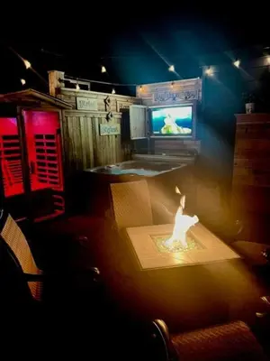 a room with a tv and a table with a candle at Reno Romantic Couples Retreat in Reno