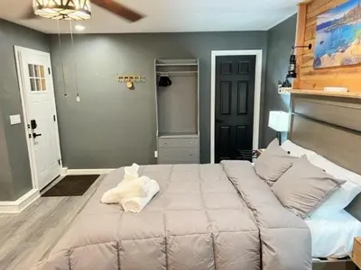 a bedroom with a large bed in a room at Romantic Couples Retreat - Tahoe Room in Reno