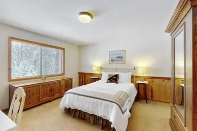 a bedroom with a large bed and a window at North Shore Escape in Carnelian Bay
