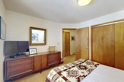 a bedroom with a bed and a television on a dresser at North Shore Escape in Carnelian Bay