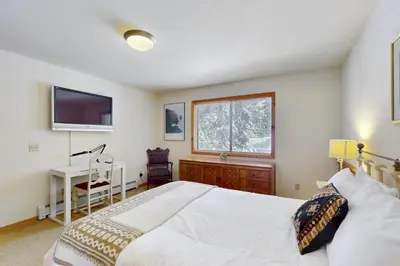 a bedroom with a large bed and a television at North Shore Escape in Carnelian Bay