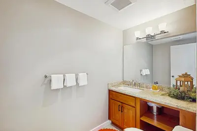a bathroom with a sink and a mirror at Northstar Paradise in Ponderosa Fairway Estates
