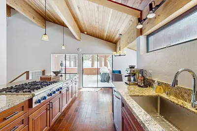 a kitchen with a sink and a stove top oven at Northstar Paradise in Ponderosa Fairway Estates