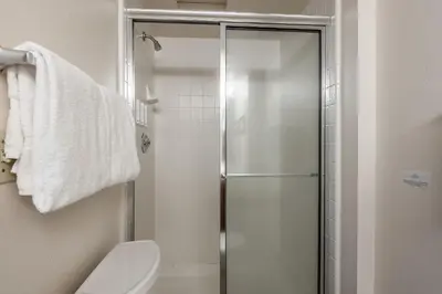 a bathroom with a toilet and a glass shower at Silverbear #41 - 2 Bedrm + Loft / 3 Bathrm 1/2 block to Canyon Lodge! Slps 8 in Mammoth Lakes