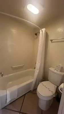 a bathroom with a white toilet and a bath tub at LLC1236 - Lakeside Landing condo in South Lake Tahoe