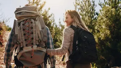 a young girl holding the hand of a backpack at Blue Basecamp - Adventure Starts HERE! in Shaver Lake