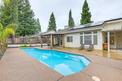 a swimming pool in front of a house at Family Home Near Folsom Lake in El Dorado Hills! in El Dorado Hills
