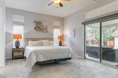 a bedroom with a bed and a large window at Family Home Near Folsom Lake in El Dorado Hills! in El Dorado Hills