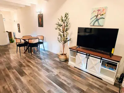 a living room with a flat screen tv and a table at 3BR Condo Near Lake & Skiing in Incline Village