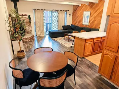 a living room with a table and chairs at 3BR Condo Near Lake & Skiing in Incline Village
