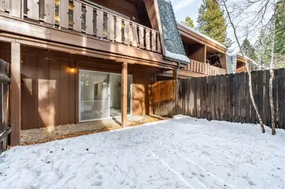 a house with a fence in the snow at 3BR Condo Near Lake & Skiing in Incline Village