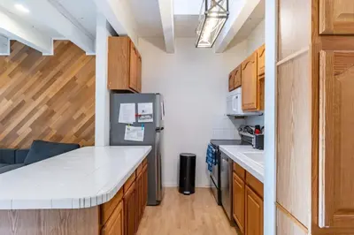 a kitchen with wooden cabinets and a refrigerator at 3BR Condo Near Lake & Skiing in Incline Village