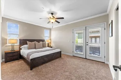 a bedroom with a bed and a ceiling fan at New Elegant 1BR Retreat Heated Pool Gym & Sauna in Reno