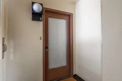 a wooden door with a window in a room at Cedar and Snow in Mammoth Lakes