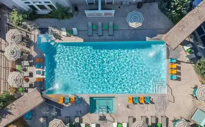 an overhead view of a swimming pool at a resort at New Cozy & Stylish 1BR with Heated Pool Relaxing Spa & Sauna in Reno