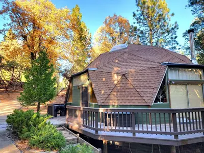 a house with a shingled roof at Unique and Secluded Dome Getaway near Sacramento, California in Pioneer