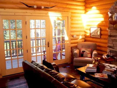 a living room with a couch and chairs in a cabin at Family-Friendly Log Cabin Rental in California's Gold Country near Sacramento in Volcano