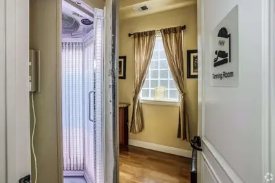 a hallway with a door leading to a window at New Cozy 1BR Apt with Gym Sauna & Heated Pool Access in Reno