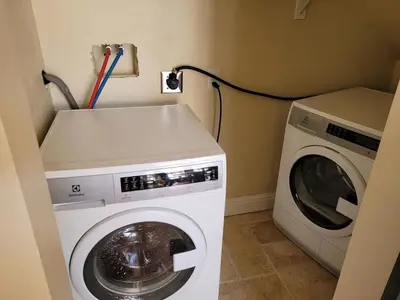 a washing machine and a washer in a room at Newly remodeled mountain home! in Floriston