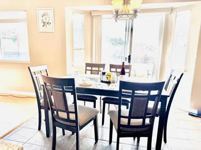 a dining room with a black table and chairs at Home at Yosemite Oakhurst in Oakhurst