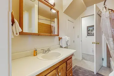 a bathroom with a sink and a mirror at Mountain View Getaway in Stateline