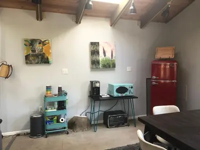 a room with a refrigerator and a table with a microwave at Delilah Ridge Winery Mid Mod Guesthouse in Squaw Valley